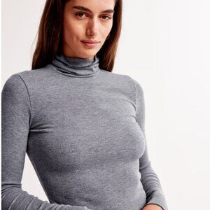 Abercrombie & Fitch Long-Sleeve Rib Tuckable Mockneck Top (Brown/Mauve)